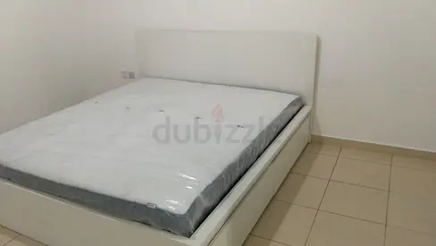 Ikea White queen-size upholstered bed frame with mattress