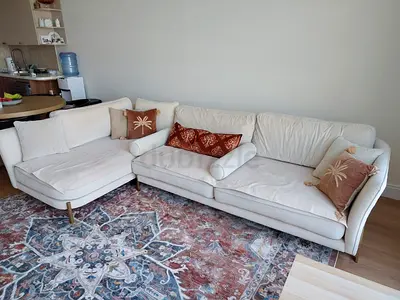 Spacious beige L-shaped sofa