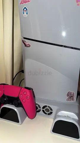PlayStation five with pink controller