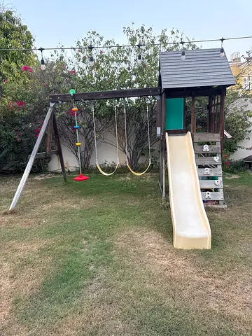 Wooden outdoor playset with slide and swing - good condition