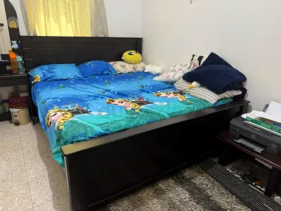 Dark wood king-size bed with mattress - very good condition, as in no flaws or damage or scratches