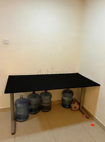 Simple black rectangular table with metal legs - good condition