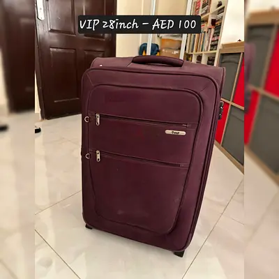 Purple large soft-shell roller suitcase, good condition