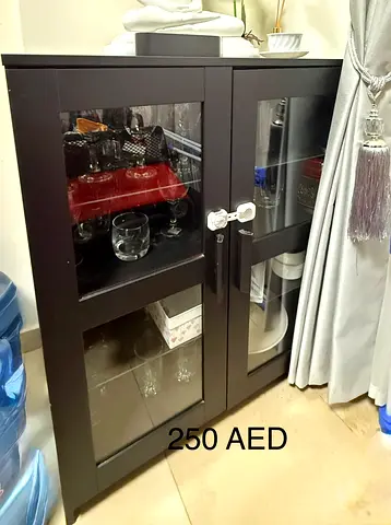 Dark wood glass-door cabinet - good condition, locks included