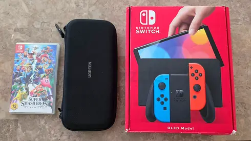 Used Like New   Nintendo Switch OLED Model Brand New | UAE Full accessories + 1 Game + Case