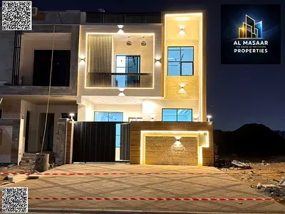 Two-story villa with a rooftop terrace, price includes registration and ownership fees, located on the main street, ready to move in, in one of Ajman'