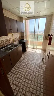 A large room and living room with a laundry room and balcony in Rawda 2