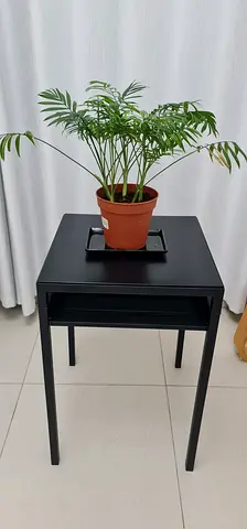 Simple black metal side table