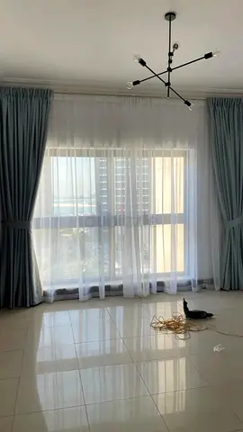 Pair of light blue blackout curtains with white sheer panels — excellent condition