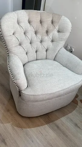 Light beige tufted accent armchair from Pottery Barn. 360° swivel (rotating)