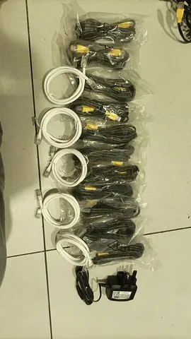 Bundle of composite RCA and USB cables with power adapter — unused