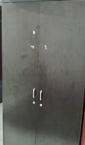 Used two-door wardrobe / cabinet in dark wood finish - good for storage