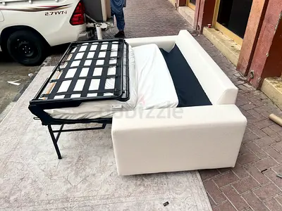 Light beige fabric sofa bed (pull-out) - good condition