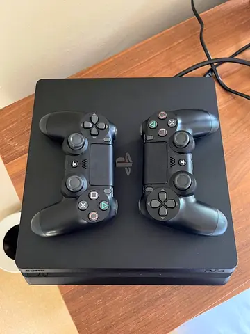 PS4 Slim 1Tb With 2 Controllers - Good Condition