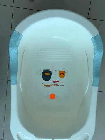 Used white baby bathtub with non-slip grips — good condition