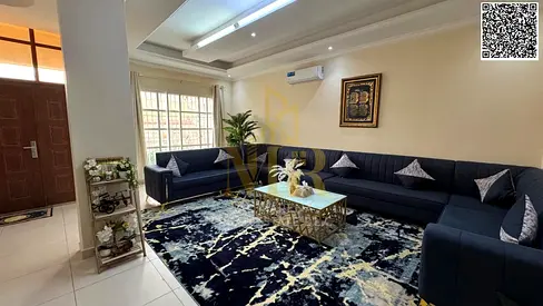 Elegant two-story villa with a roof in Al Muwaihat 1, priced inclusive of services.