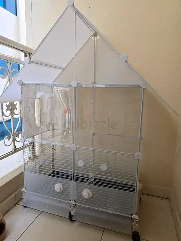 Large white bird cage with front clear display. Can be deassembled — good condition
