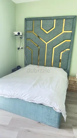 Light teal upholstered double bed with decorative headboard - good condition Size 180x200 king bed