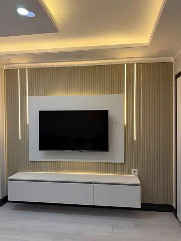 Wall-mounted TV unit with modern panel and floating cabinet