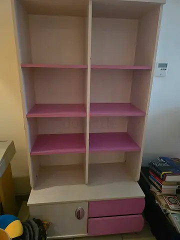 Light wood and pink kids bookshelf with drawers