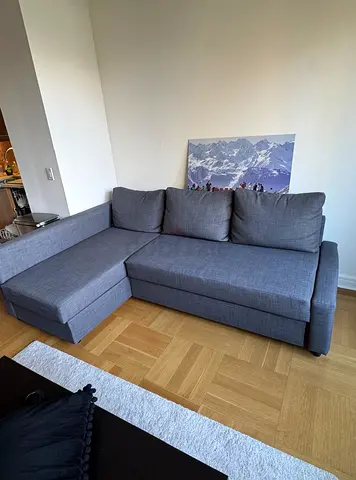 Grey L-shaped sofa bed with chaise - good condition