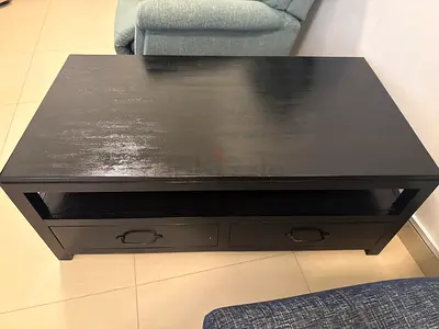 Solid dark wood coffee table with storage drawers