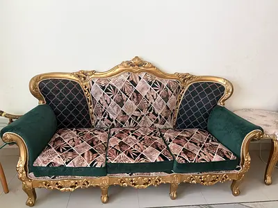 Ornate Gold-Trimmed 4-Seater Sofa with Green Velvet and Patterned Cushions