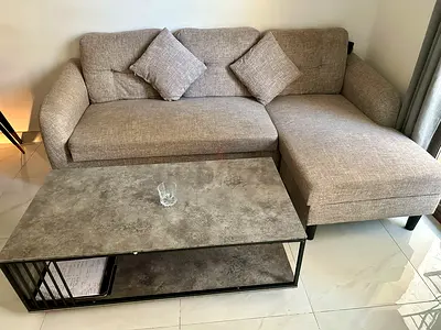 Urgent Sale | Gray L-shaped Sofa cum Bed with Cushions and Coffee Table | Serious Buyers only