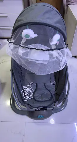 Baby rocker/bouncer with canopy and toys - gently used