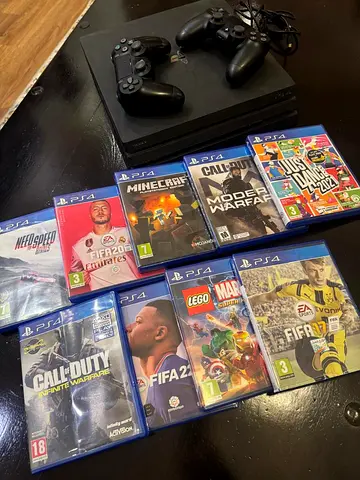 PS4 console with 2 controllers and 9 games (FIFA, Call of Duty, Minecraft, Just Dance)
