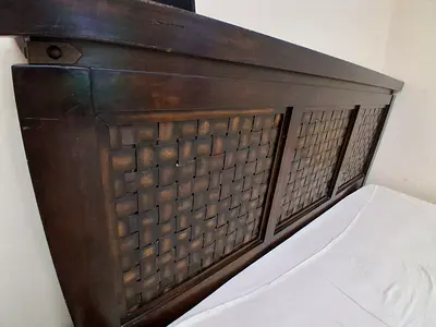 Solid Dark Wood King size. Headboard with Woven Panel Detailing