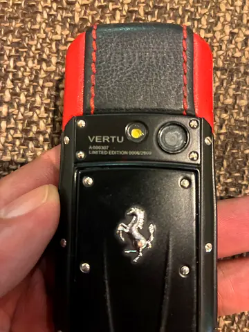 Vertu Ferrari-branded luxury phone (used) - leather back, metal accents