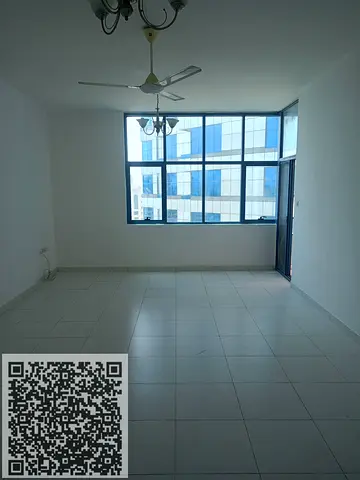 Two-bedroom apartment with living room for annual rent in Falcon Towers, Ajman, Al Rashidiya 2, with parking.