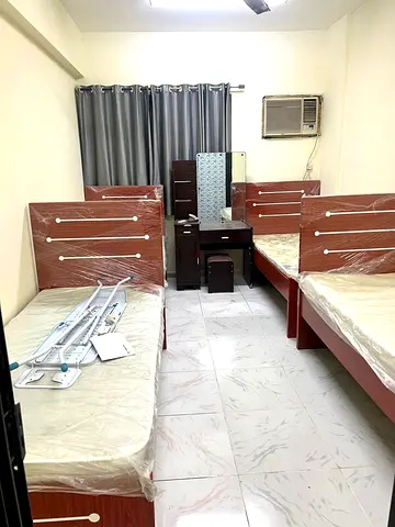 Room available- Immediately- 4 in room-single bed- attached wash in Karama