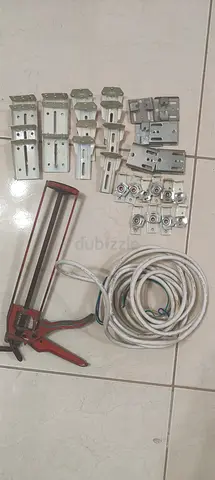 Bulk electrical mounting brackets, cable and sealant gun - used set