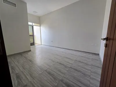 One bedroom and living room, Al Jurf 3, Ajman, parquet flooring, 2 balconies, central air conditioning, free maintenance