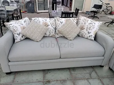 Light grey 3-seater + 2 seater sofa with floral cushions - good condition