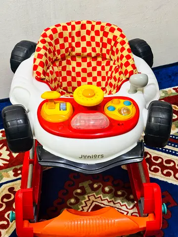 Used baby walker with activity tray and padded seat - good condition