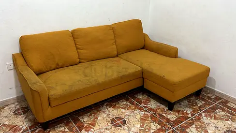 Used mustard yellow L-shaped 3-seater sofa with chaise
