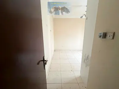 One bedroom and living room for rent in al Nahda, spacious area, free maintenance