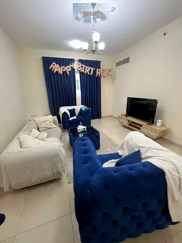 2-bedroom apartment with a living room in Al Qasba for monthly rent, modern furnishing, internet included