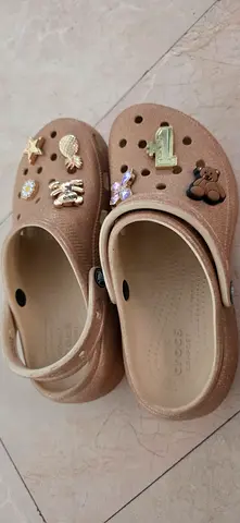 Beige Crocs-style Slip-on Clogs with Jibbitz Charms - Size 7
