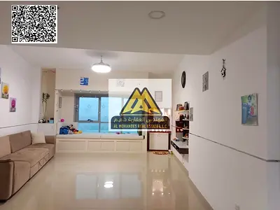 A fantastic opportunity for annual rent in Corniche Tower: a two-bedroom apartment with a living room and a direct sea view. Featuring spacious living