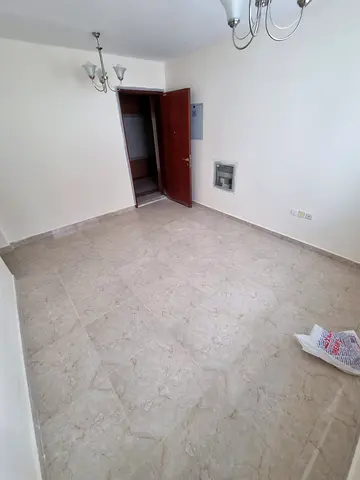 For rent in Al Qulayaa Sharjah spacious one bedroom hall master room central AC price 30000 deposit 2000 deferred payment 4 or 6