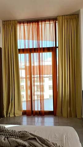 Full-length beige curtains with sheer orange voile - set for balcony window