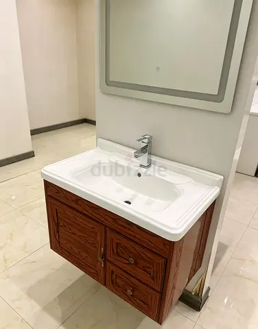 Wall-mounted wooden bathroom vanity with mirror and LED lights