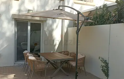 Outdoor rattan dining set with table and cantilever umbrella — good condition