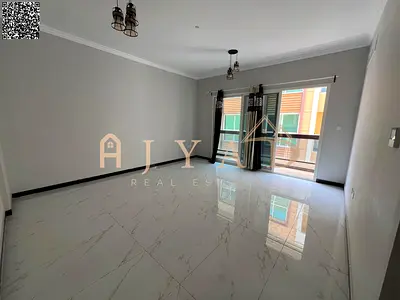 1BR apartment for annual rent in Al Mowaihat 3, Ajman. Master bedroom, 2 baths, central AC, wardrobes, 1 month free, easy Dubai exit, flexible payment