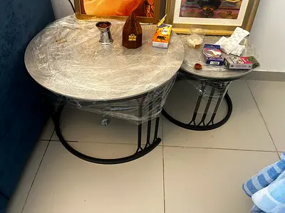 Set of 2 round metal nesting coffee side tables (black frame, glass tops)