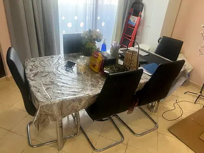 Dining table with 4 chrome-legged chairs (used) - good condition